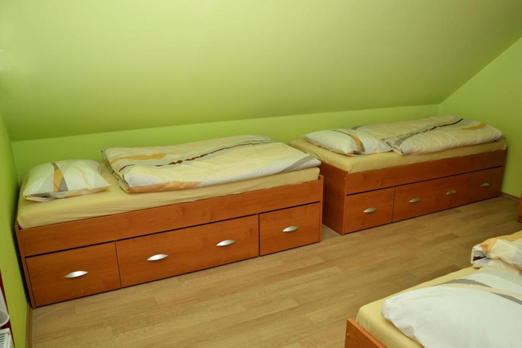 Postel nebo postele na pokoji v ubytování Penzion Veritas