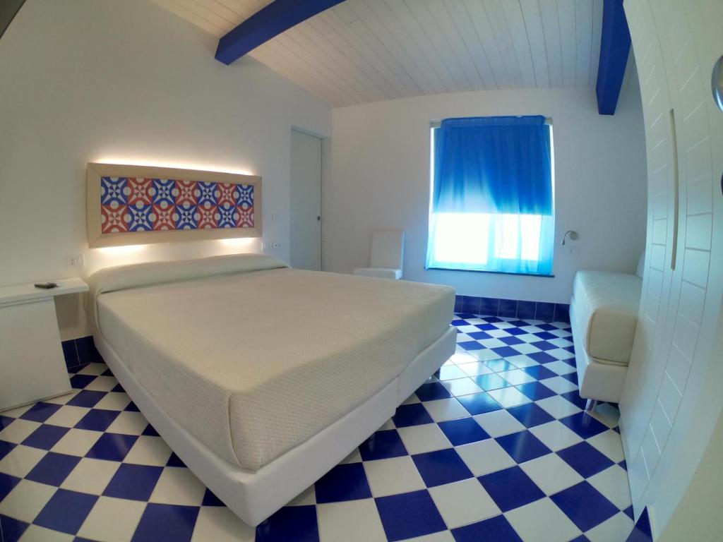 Postel nebo postele na pokoji v ubytování Hotel La Nave