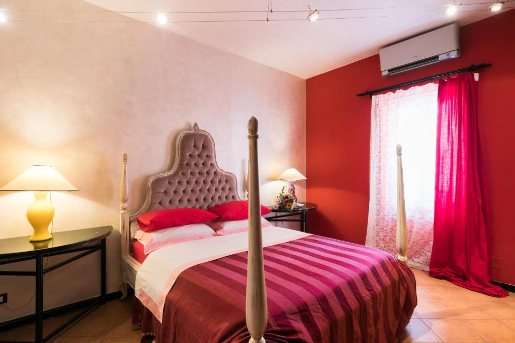Una cama o camas en una habitación de Appartamenti MarcoAurelio49