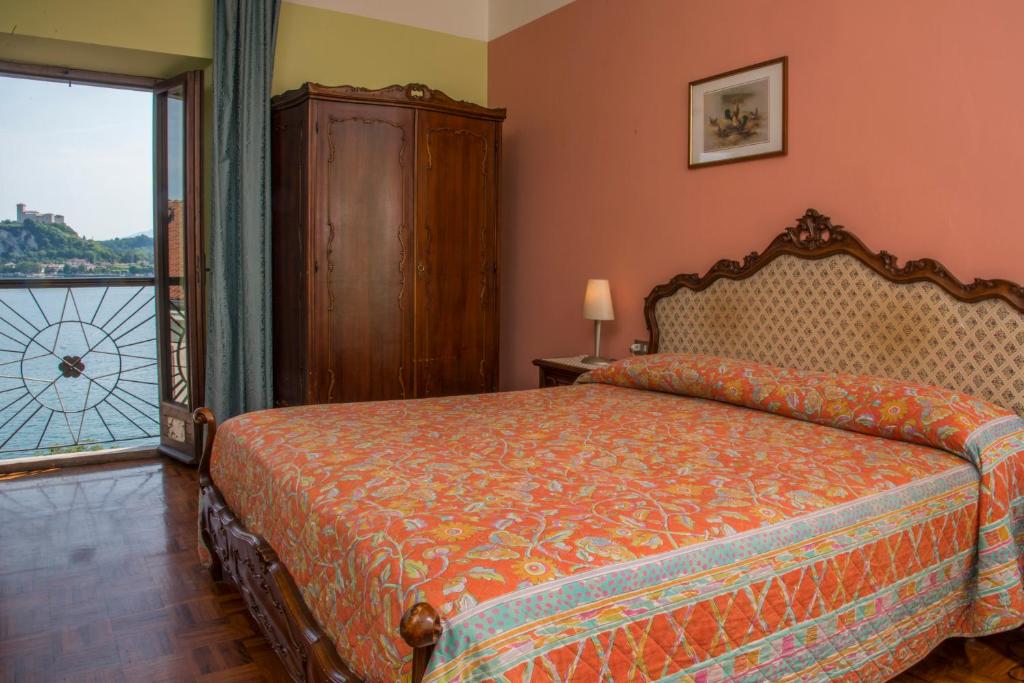 Postel nebo postele na pokoji v ubytování Hotel Florida