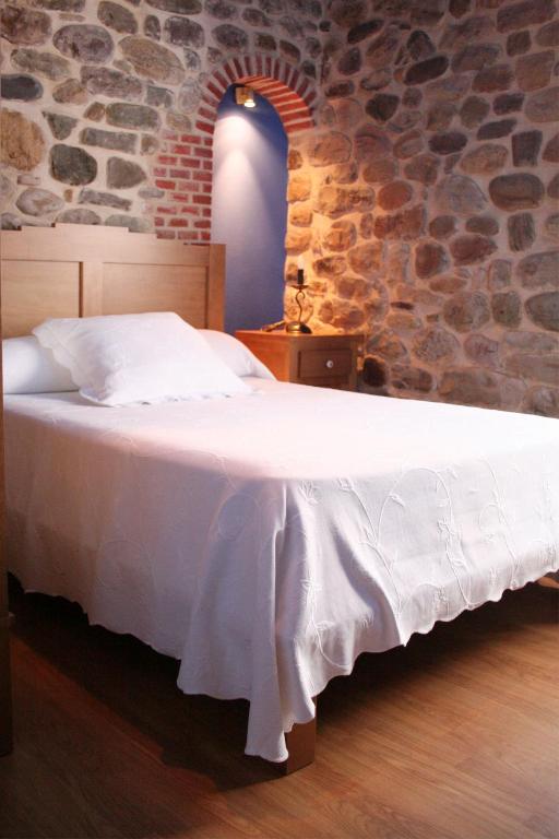 Postel nebo postele na pokoji v ubytování Posada El Arrabal