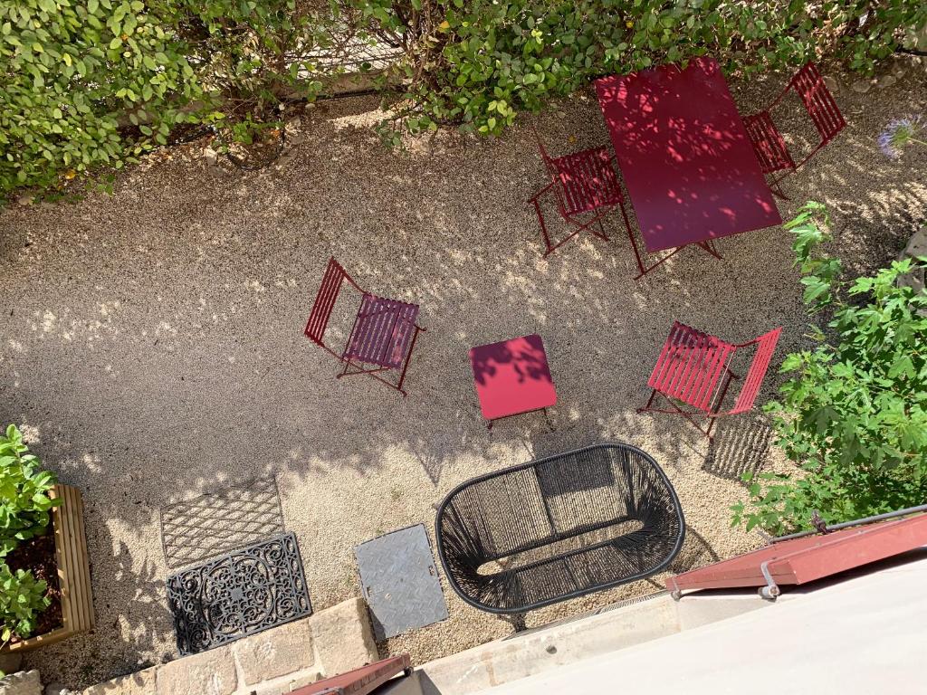 an overhead view of chairs and tables and a mirror at LES CIGALES in L'Isle-sur-la-Sorgue