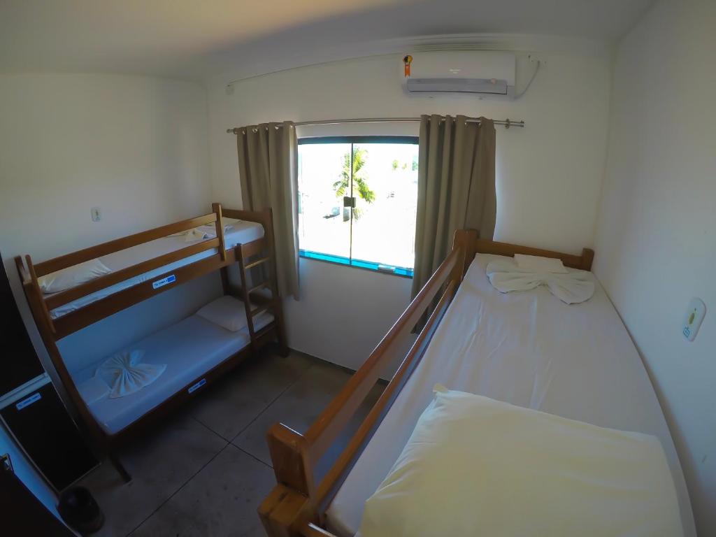 Postel nebo postele na pokoji v ubytování Maraga Beach Hostel