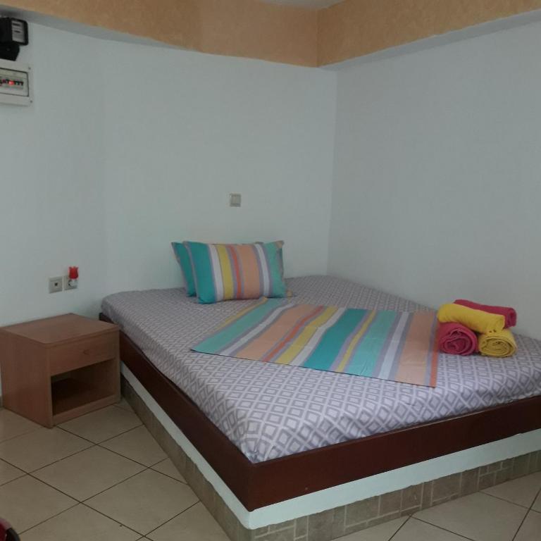 Łóżko lub łóżka w pokoju w obiekcie Ground Floor Studio Galini