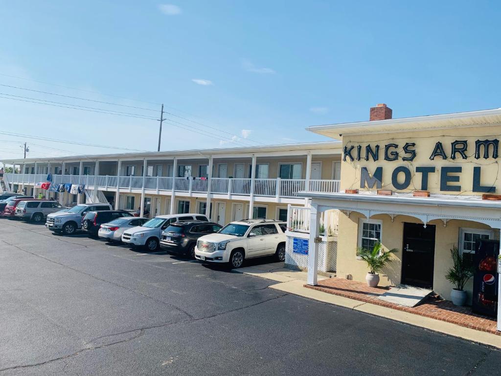 a row of cars parked in front of a motel at Kings Arms Motel in Ocean City