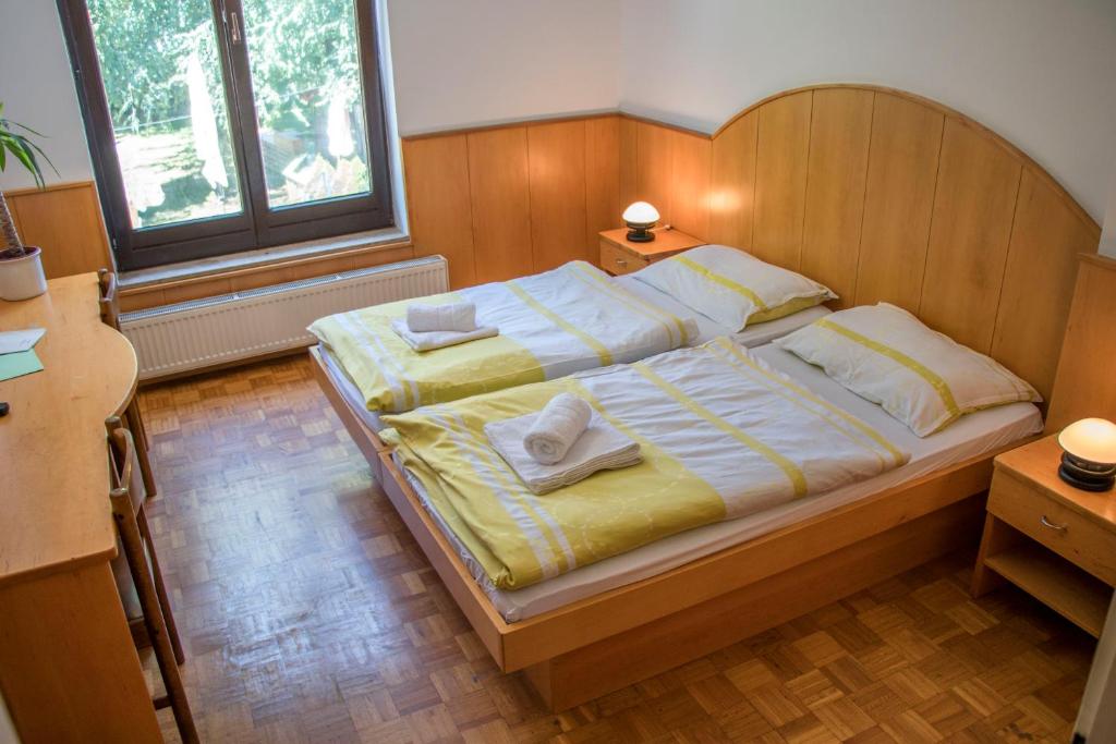 Lova arba lovos apgyvendinimo įstaigoje Guest House Park Žibert