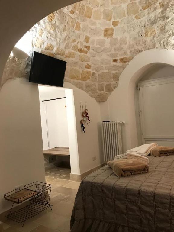 Postel nebo postele na pokoji v ubytování Trulli Pietraverde