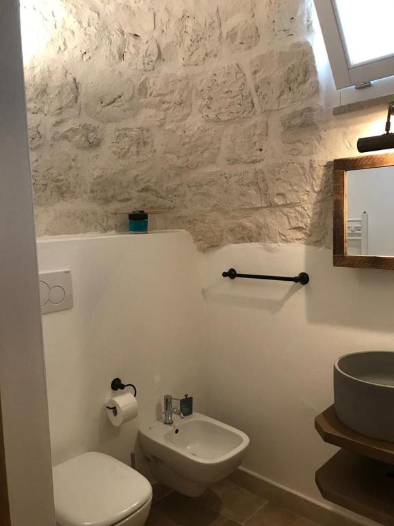 Koupelna v ubytování Trulli Pietraverde