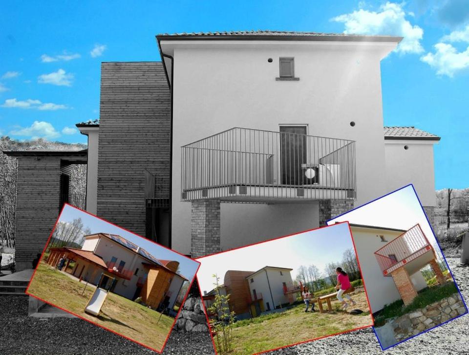 uma casa com uma varanda ao lado em Country House Poggio Alto em Buonabitacolo