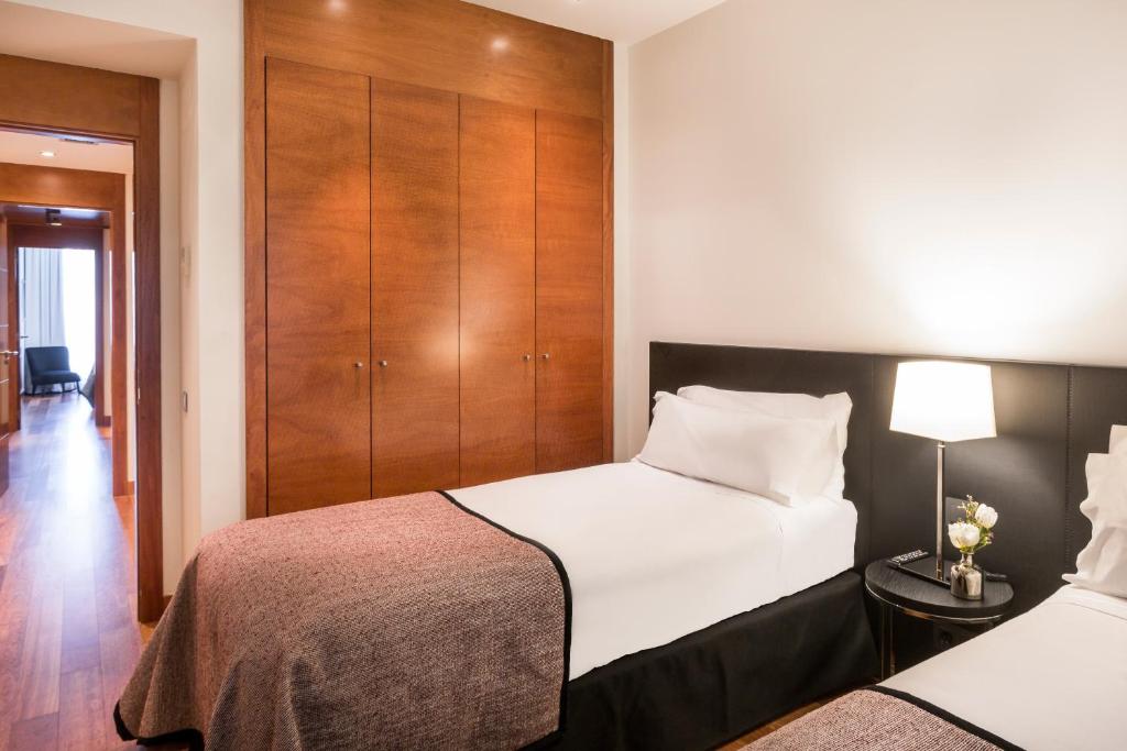 Postel nebo postele na pokoji v ubytování Majestic Hotel & Spa Barcelona GL