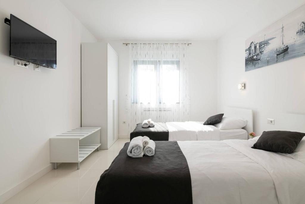 Postel nebo postele na pokoji v ubytování Villa Elodie