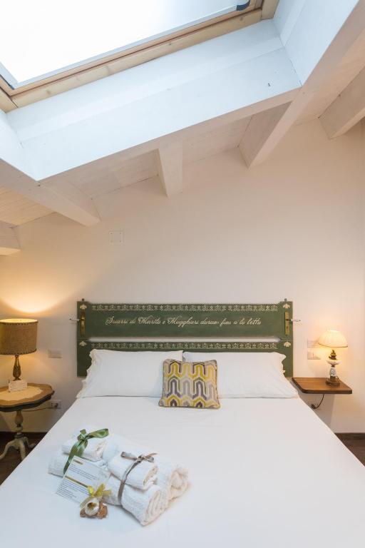 Ένα ή περισσότερα κρεβάτια σε δωμάτιο στο Addimora Boutique Suites