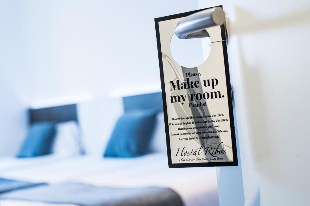 Postel nebo postele na pokoji v ubytování Hostal Ribas
