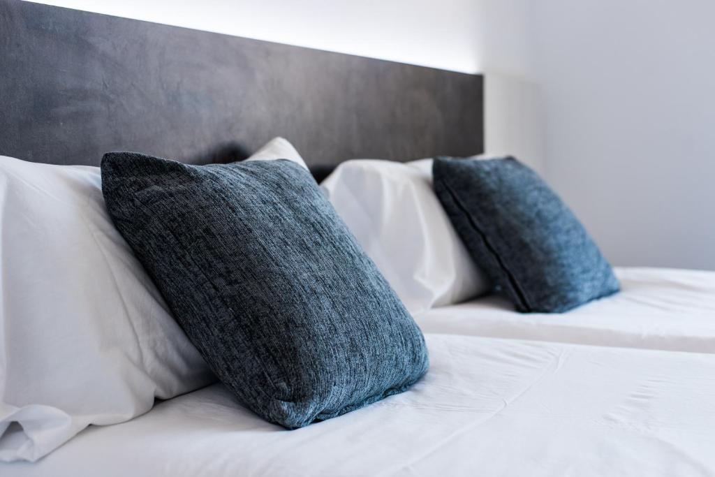 Postel nebo postele na pokoji v ubytování Hostal Ribas