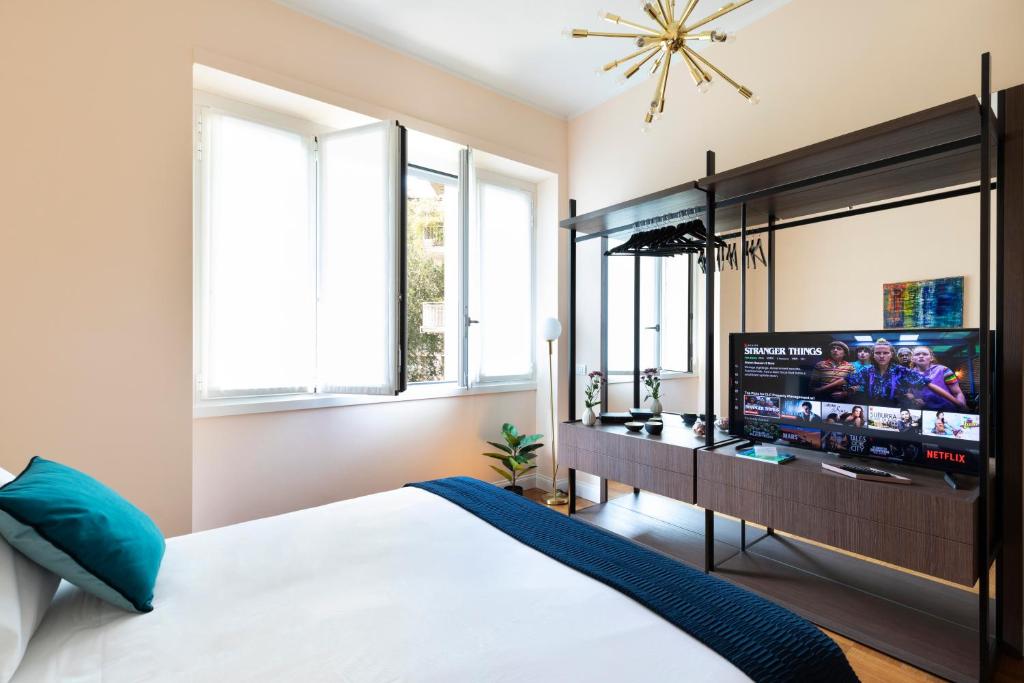 Posteľ alebo postele v izbe v ubytovaní Milano Manzoni CLC Apartments