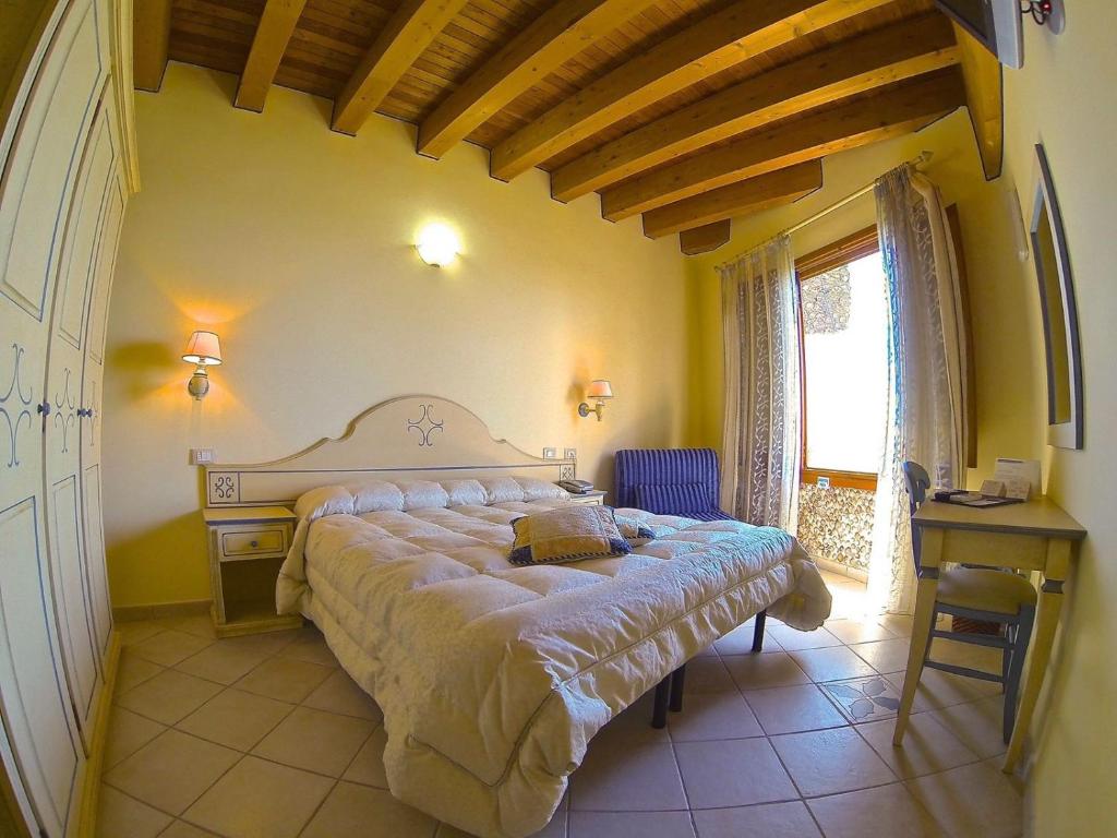 Postel nebo postele na pokoji v ubytování Hotel La Nave