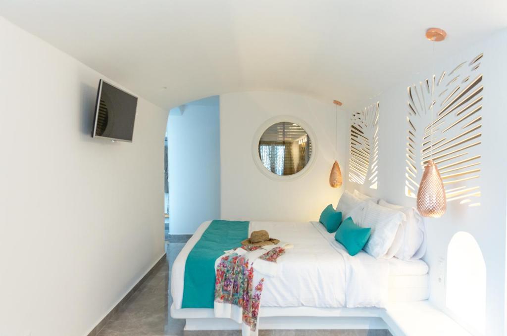 Postel nebo postele na pokoji v ubytování Margarita Hotel
