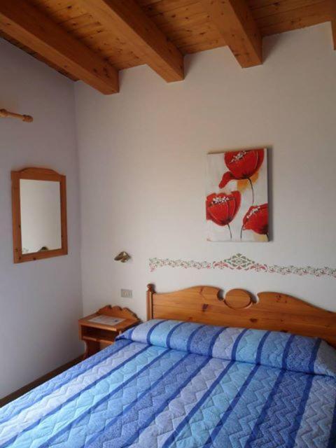 Postel nebo postele na pokoji v ubytování Hotel Garni Tosca