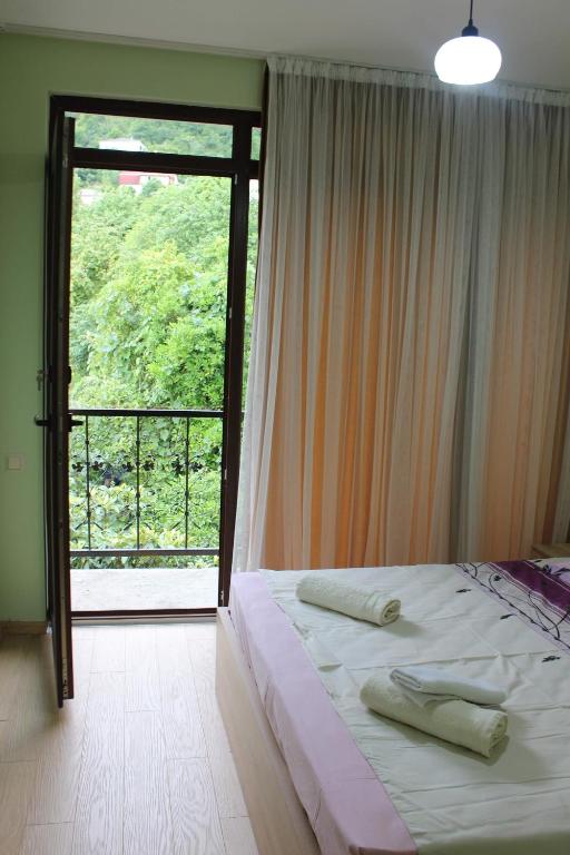 Postel nebo postele na pokoji v ubytování Guesthouse Maria