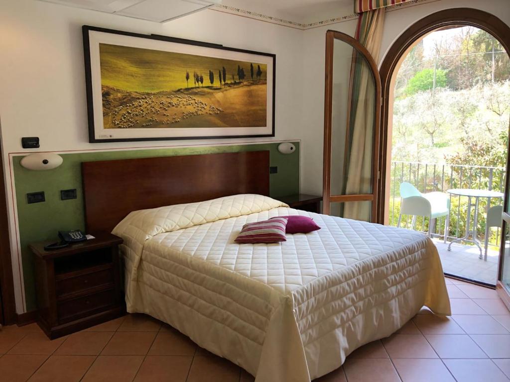 Postel nebo postele na pokoji v ubytování Hotel Sovestro