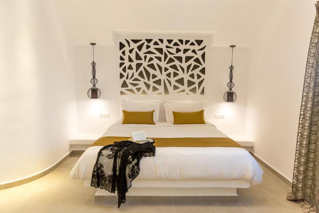Postel nebo postele na pokoji v ubytování Margarita Hotel