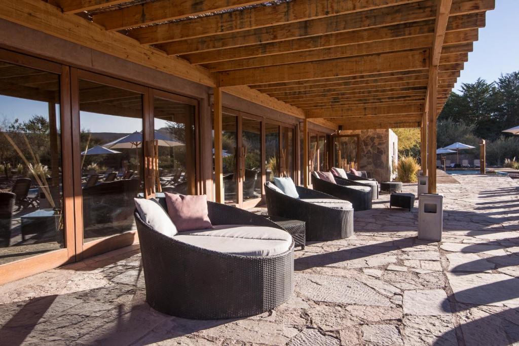 Uma área de estar em Hotel Cumbres San Pedro de Atacama