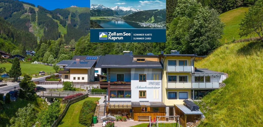 a house in the mountains with a view of a lake at Appartement Schaubensteiner in Zell am See