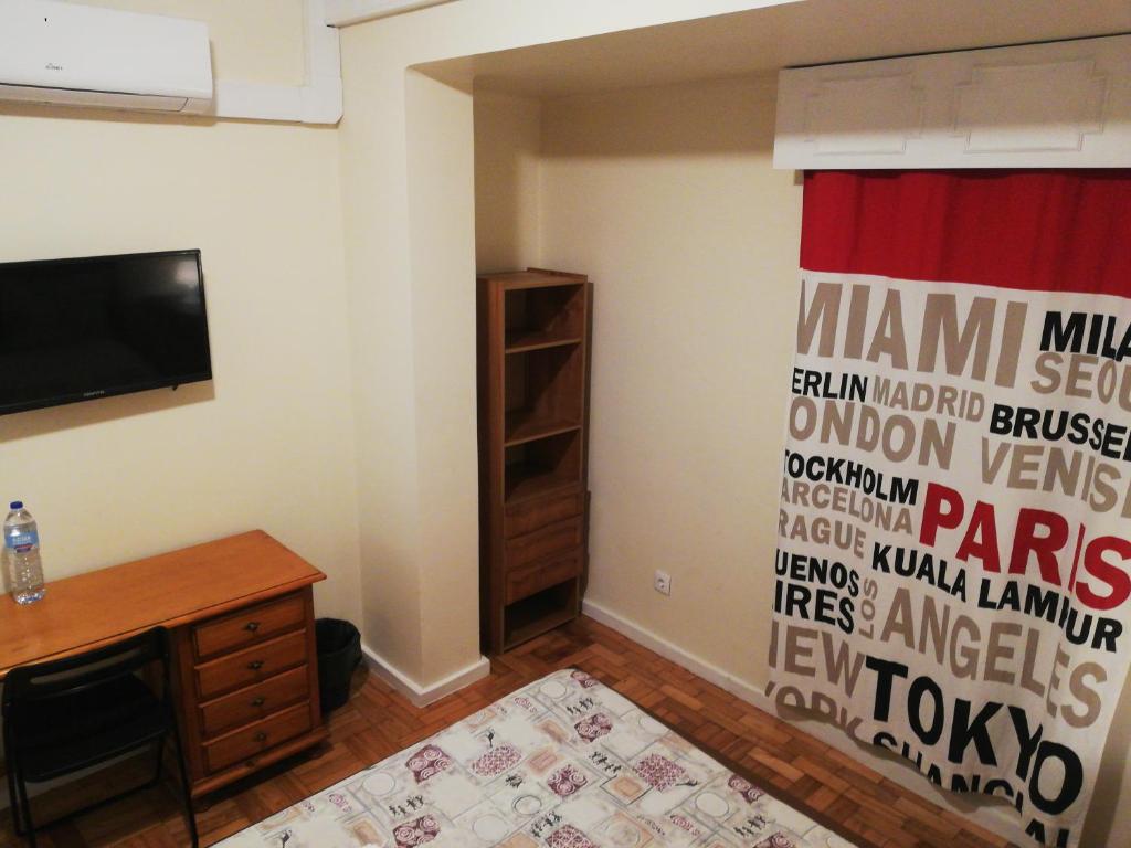 TV a/nebo společenská místnost v ubytování MicroRent Rooms