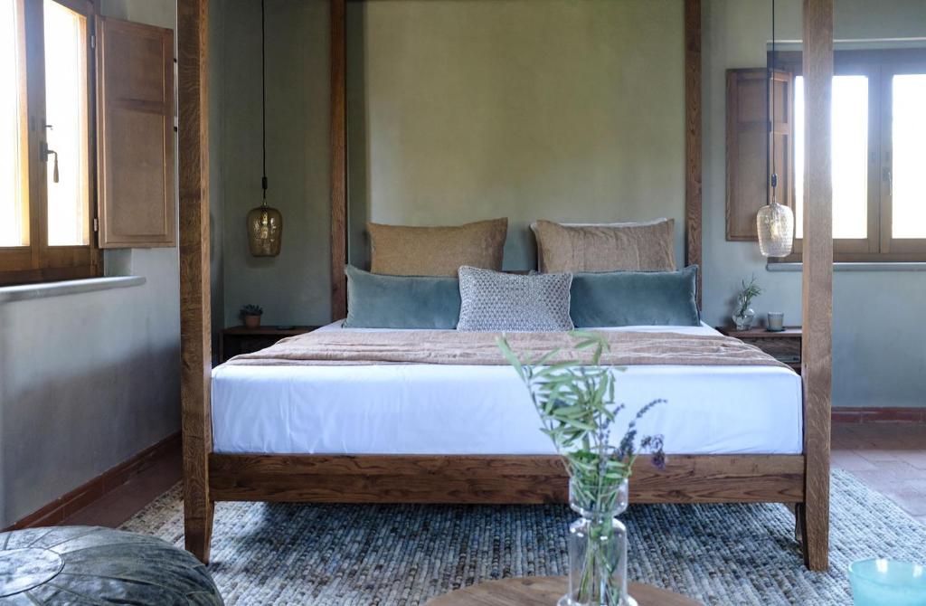 Postel nebo postele na pokoji v ubytování Borgo Castello Panicaglia