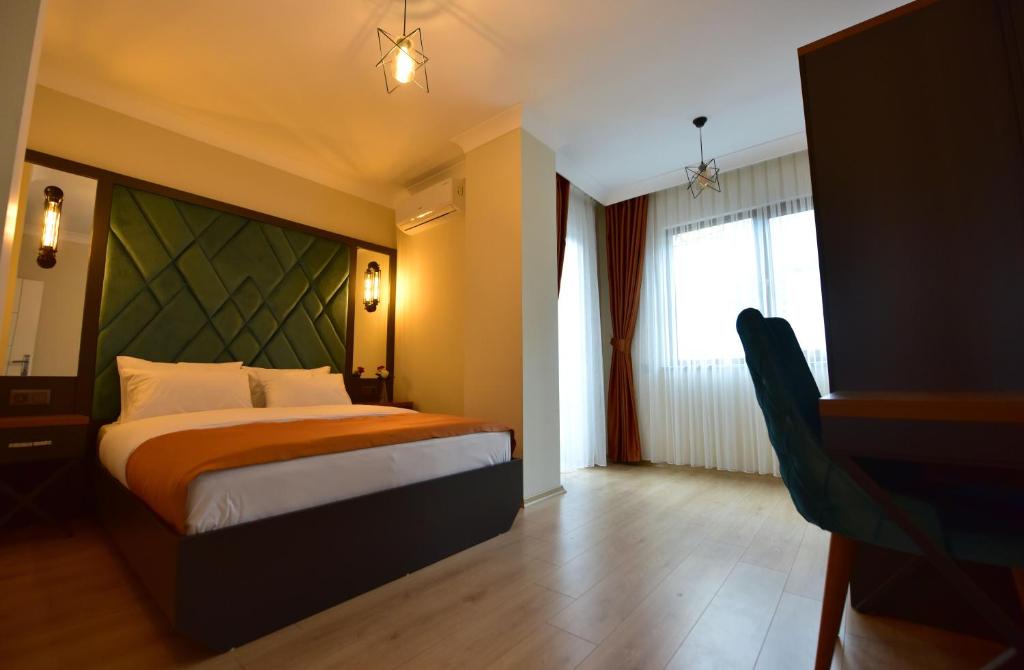a hotel room with a bed and a window at İnanlar Airport Residence in Trabzon