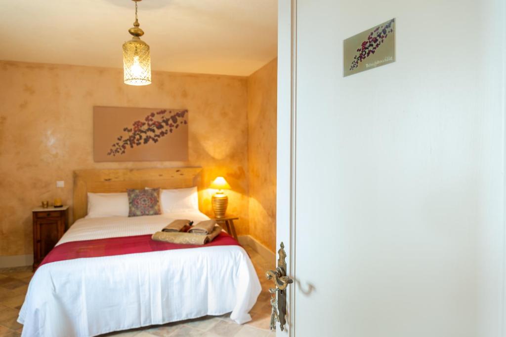 a bedroom with a bed in a room at El Hotelito del Cotillo - Adults Only in Cotillo