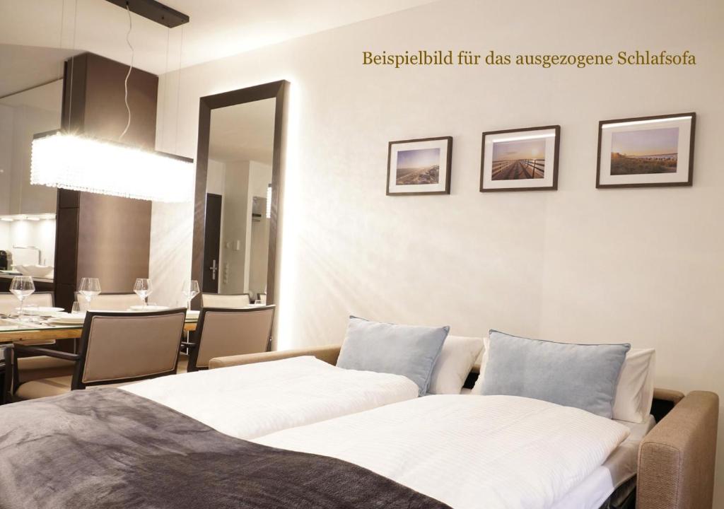Postel nebo postele na pokoji v ubytování White Pearl Apartment 1.03