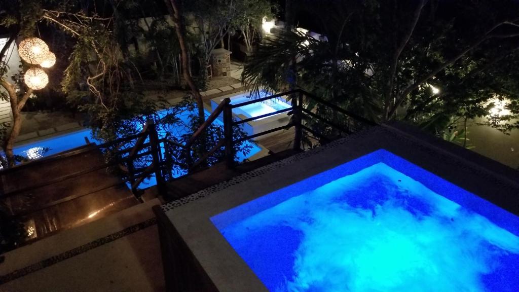 Bazén v ubytování Trece Lunas Tulum - Enchanted Resort nebo v jeho okolí