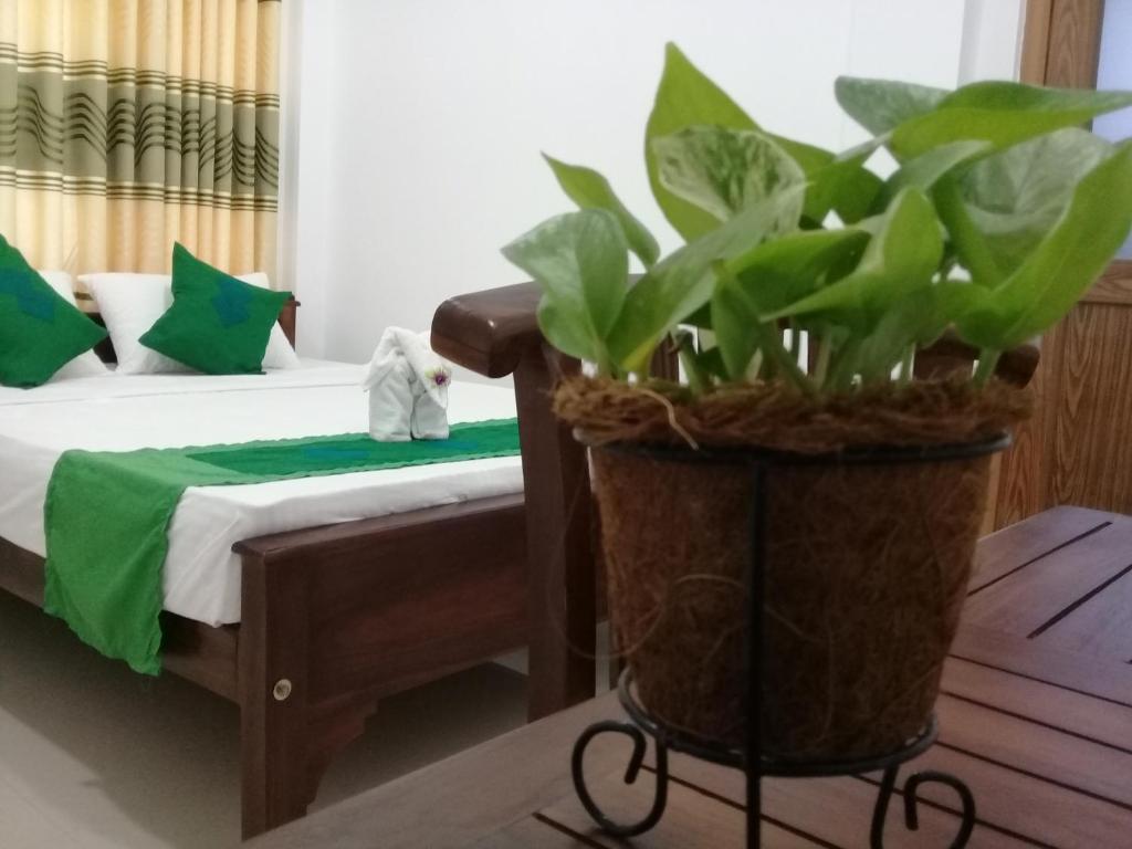 Postel nebo postele na pokoji v ubytování Green Edge Residences
