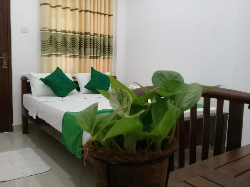 Postel nebo postele na pokoji v ubytování Green Edge Residences
