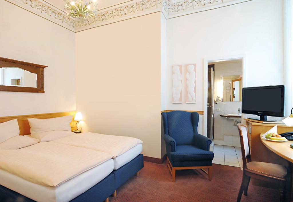 Postel nebo postele na pokoji v ubytování Hotel Jugendstil