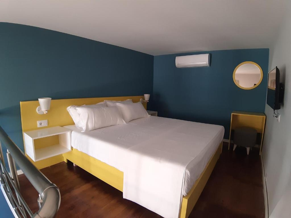 Postel nebo postele na pokoji v ubytování Bistrica Hotel