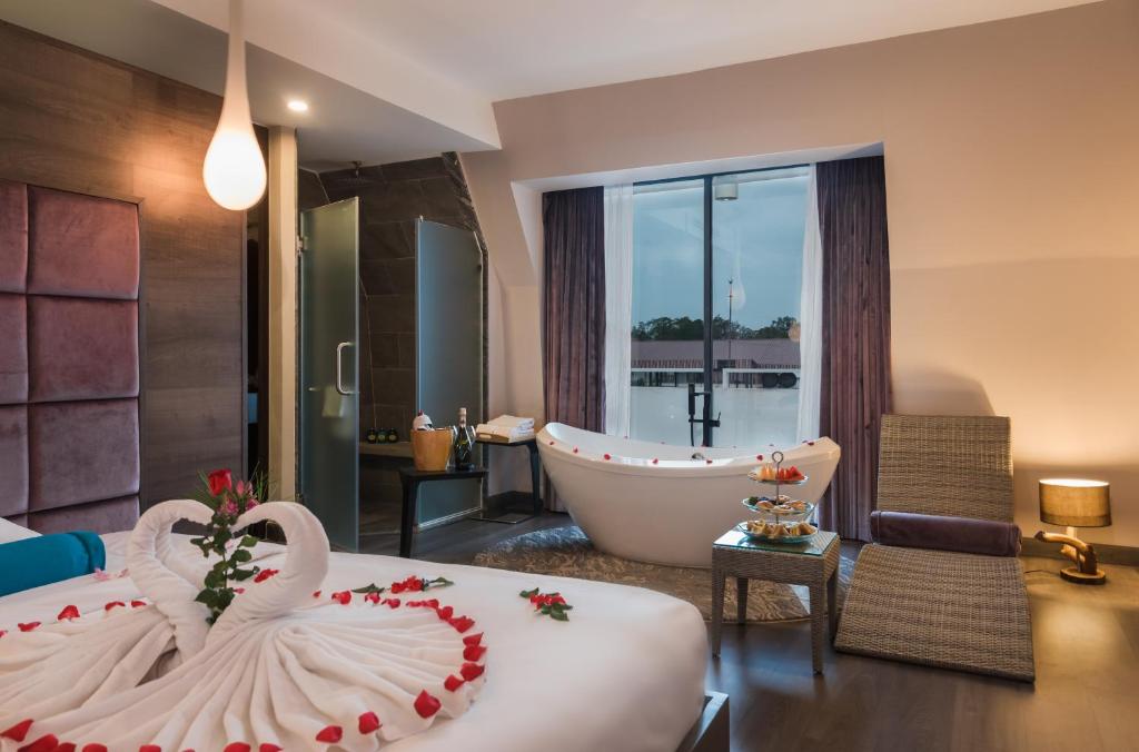 Postel nebo postele na pokoji v ubytování Damrei Residence & Spa