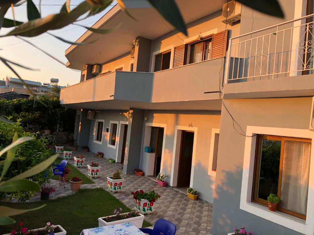 an external view of a house with a patio at Green Garden Villa in Ksamil