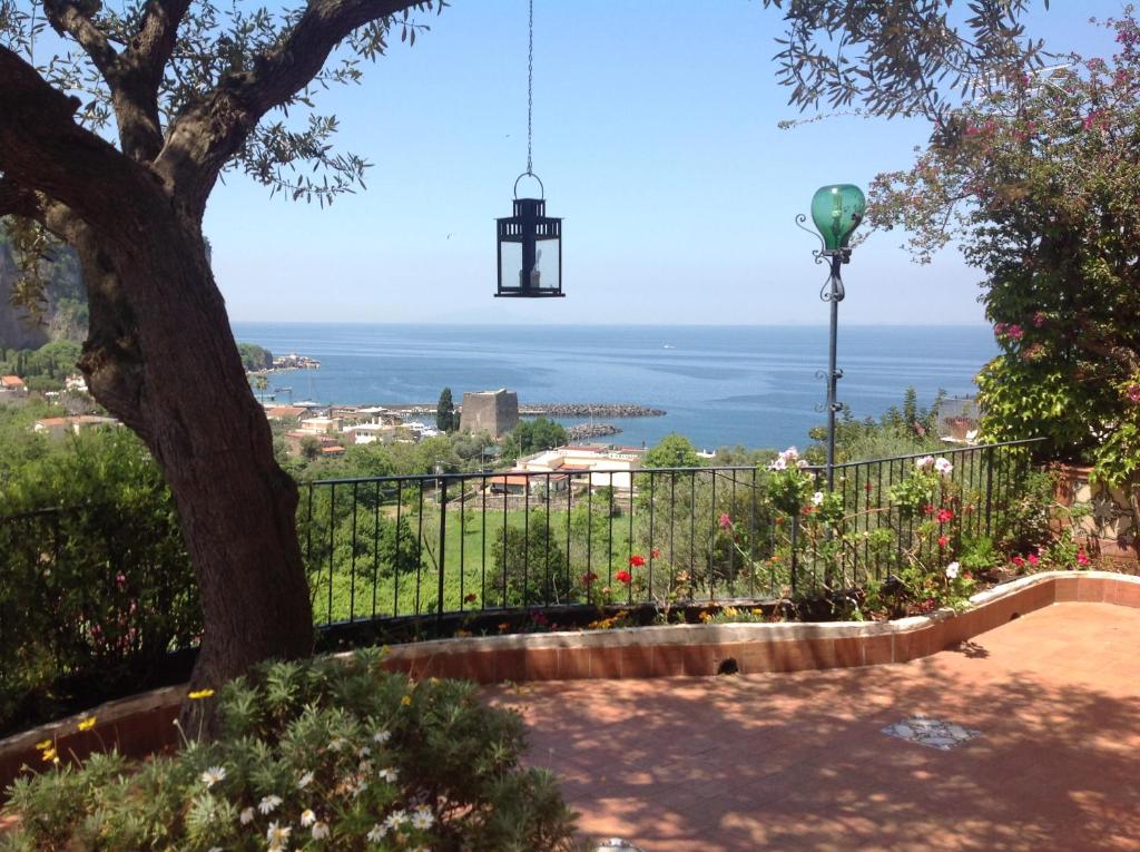 a view of the ocean from a park at Villa Flora in Vico Equense