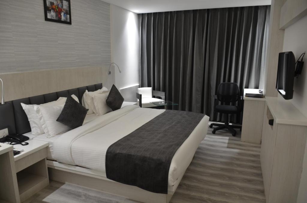 Postel nebo postele na pokoji v ubytování Hotel Radiance