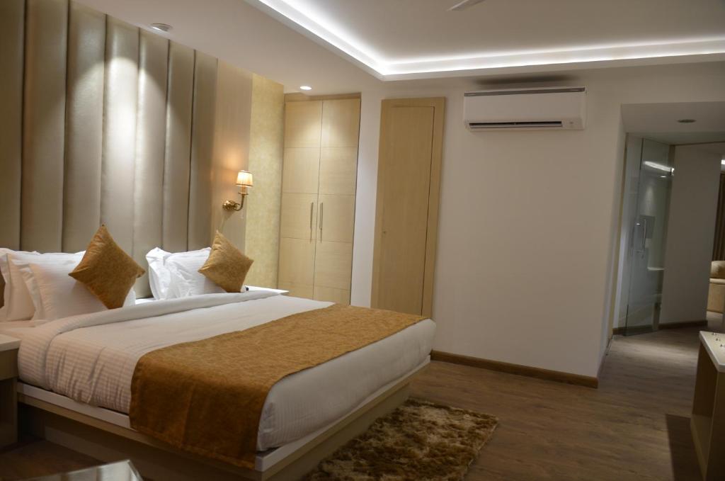 Postel nebo postele na pokoji v ubytování Hotel Radiance