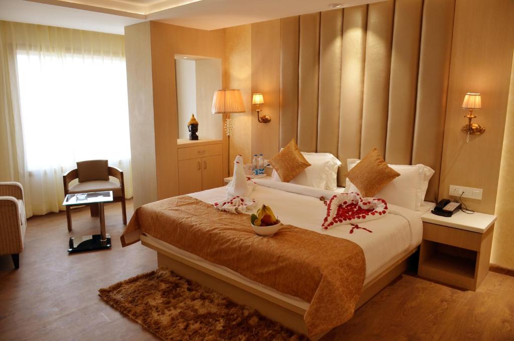 Postel nebo postele na pokoji v ubytování Hotel Radiance