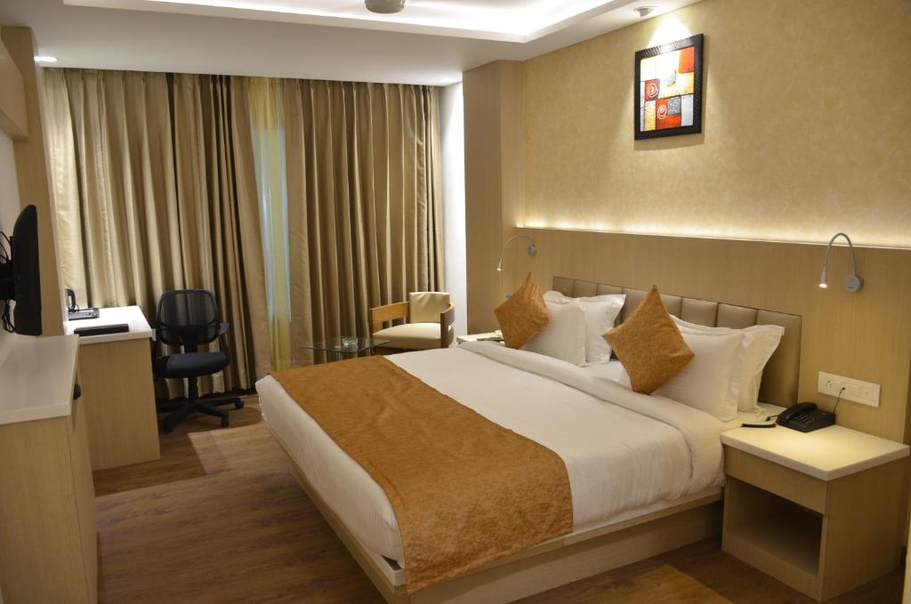 Postel nebo postele na pokoji v ubytování Hotel Radiance