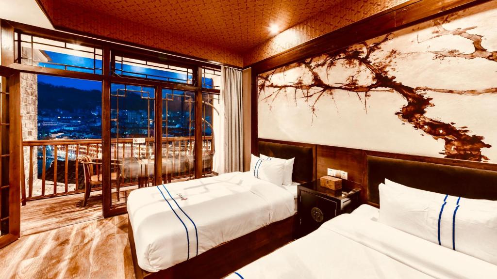 Postel nebo postele na pokoji v ubytování Wang Jiang Reclusive Boutique Inn