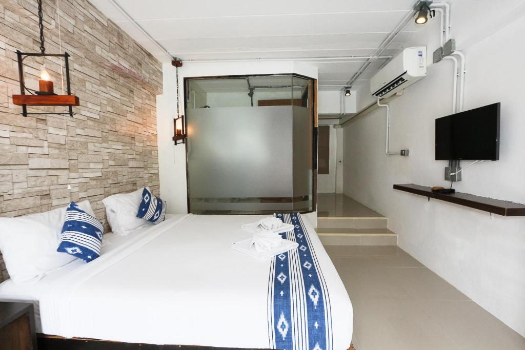 Postel nebo postele na pokoji v ubytování The Nest Resort Patong