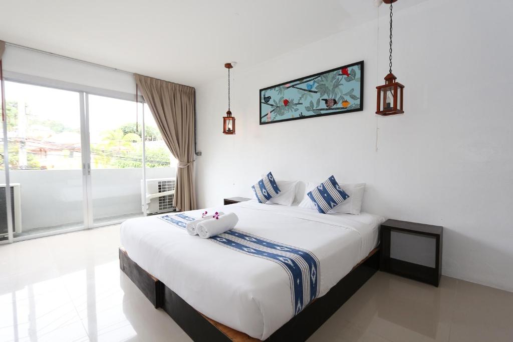 Postel nebo postele na pokoji v ubytování The Nest Resort Patong
