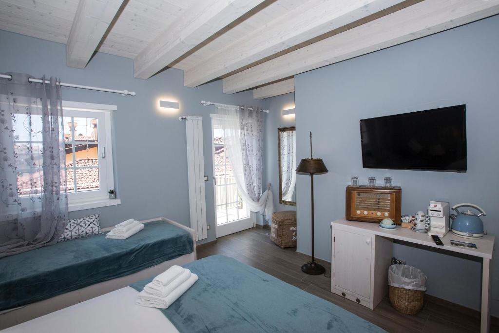 Postel nebo postele na pokoji v ubytování Laura e Christian - Rooms