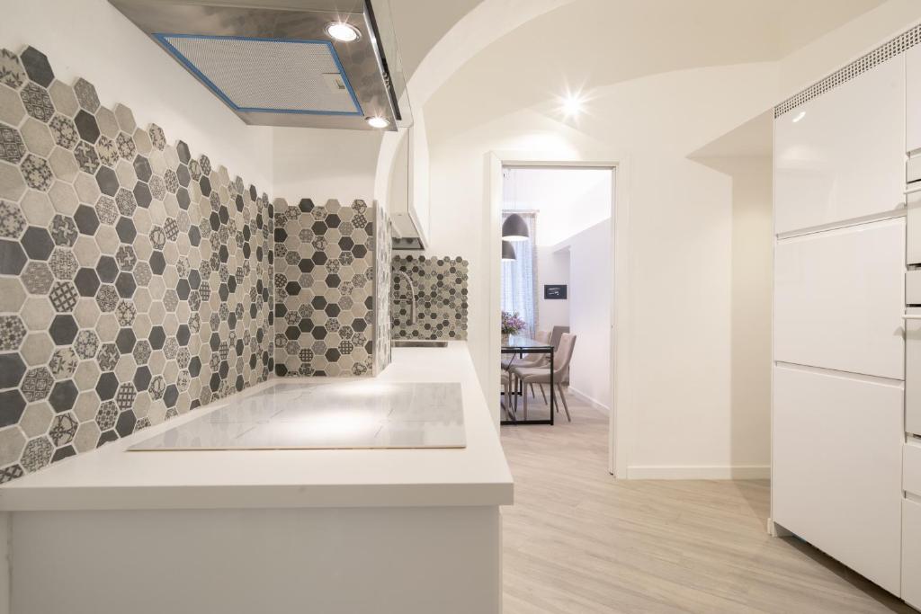 A bed or beds in a room at Palace Downtown Florence