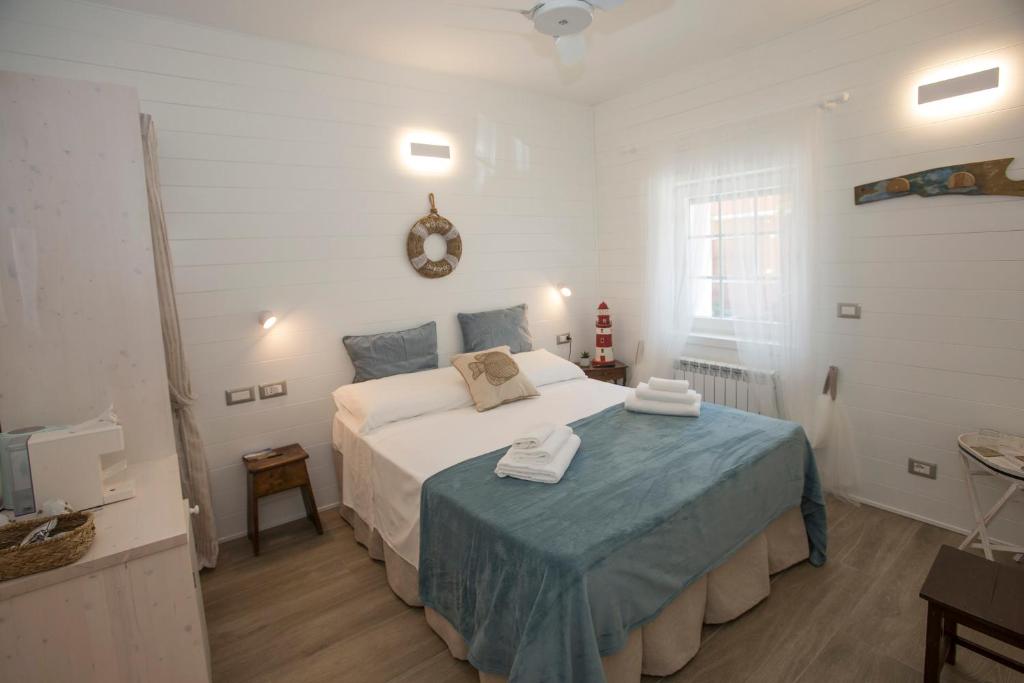 Postel nebo postele na pokoji v ubytování Laura e Christian - Rooms